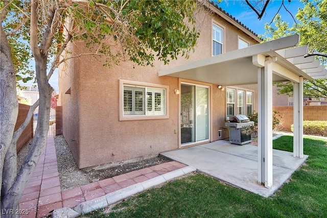 4036 W Bird Man Ln, North Las Vegas, NV 89084 - rear view of house with stucco siding and a patio area