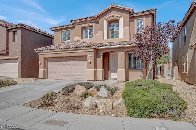 4036 W Bird Man Ln, North Las Vegas, NV 89084 - mediterranean / spanish-style home featuring a tile roof, driveway, stucco siding, and a garage