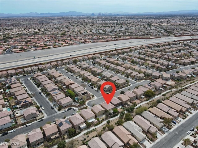 4036 W Bird Man Ln, North Las Vegas, NV 89084 - aerial overview of property's location with nearby suburban area and mountains