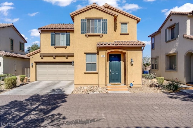 5324 Pendergrass St, North Las Vegas, NV 89081 - mediterranean / spanish-style house with a tile roof, stucco siding, a garage, and concrete driveway