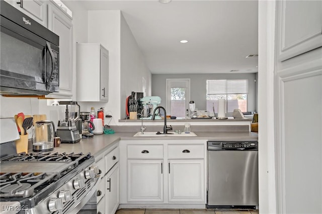 5324 Pendergrass St, North Las Vegas, NV 89081 - kitchen featuring stainless steel appliances, light countertops, white cabinets, and recessed lighting