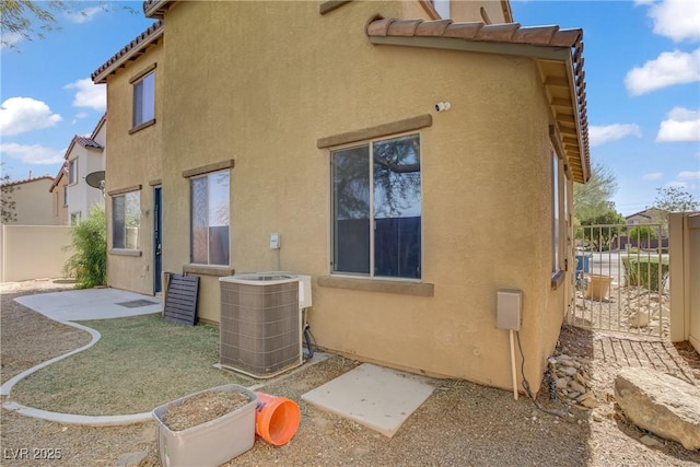 5324 Pendergrass St, North Las Vegas, NV 89081 - rear view of property with stucco siding, a tile roof, and a patio