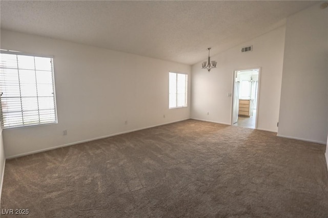 1349 Goldenglow Rd, Las Vegas, NV 89108 - unfurnished room with a chandelier, carpet, lofted ceiling, and a textured ceiling