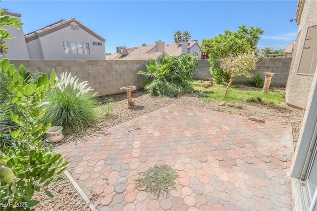 1349 Goldenglow Rd, Las Vegas, NV 89108 - fenced backyard with a patio area