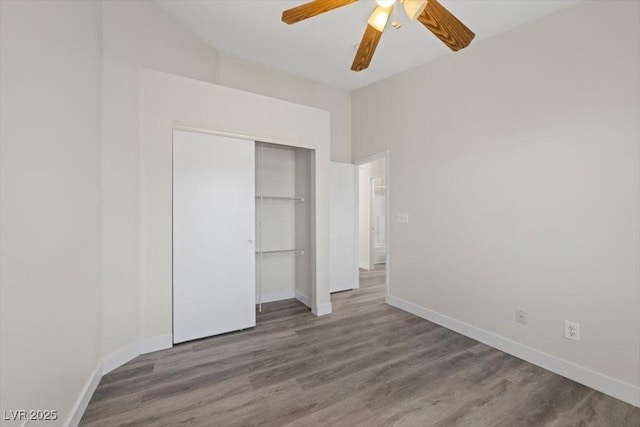 905 Harp Way N, Las Vegas, NV 89032 - unfurnished bedroom with wood finished floors, a closet, and ceiling fan