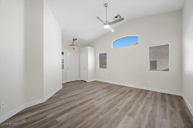 905 Harp Way N, Las Vegas, NV 89032 - spare room featuring high vaulted ceiling, ceiling fan, and wood finished floors