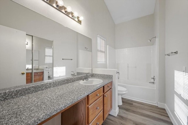 905 Harp Way N, Las Vegas, NV 89032 - full bathroom featuring vanity, shower / tub combination, wood finished floors, and vaulted ceiling