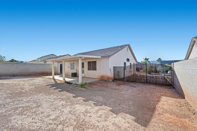 905 Harp Way N, Las Vegas, NV 89032 - back of house with a patio, a fenced backyard, and stucco siding