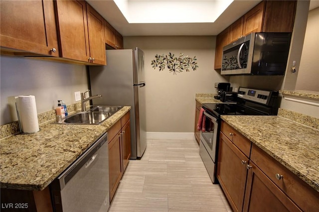 4200 S Valley View Blvd Unit 1035, Las Vegas, NV 89103 - kitchen featuring appliances with stainless steel finishes and brown cabinetry