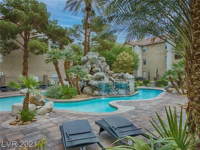 4200 S Valley View Blvd Unit 1035, Las Vegas, NV 89103 - community pool featuring a patio