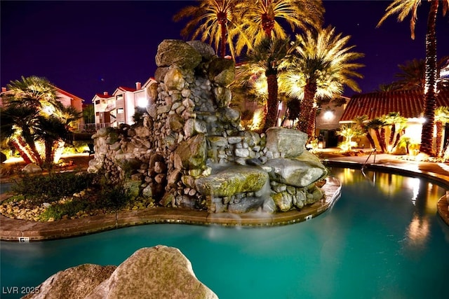 4200 S Valley View Blvd Unit 1035, Las Vegas, NV 89103 - pool at night featuring an outdoor pool