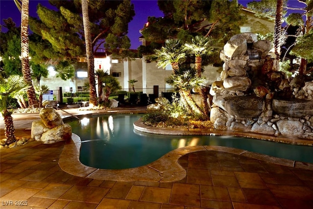 4200 S Valley View Blvd Unit 1035, Las Vegas, NV 89103 - pool at twilight with an outdoor pool and a patio area