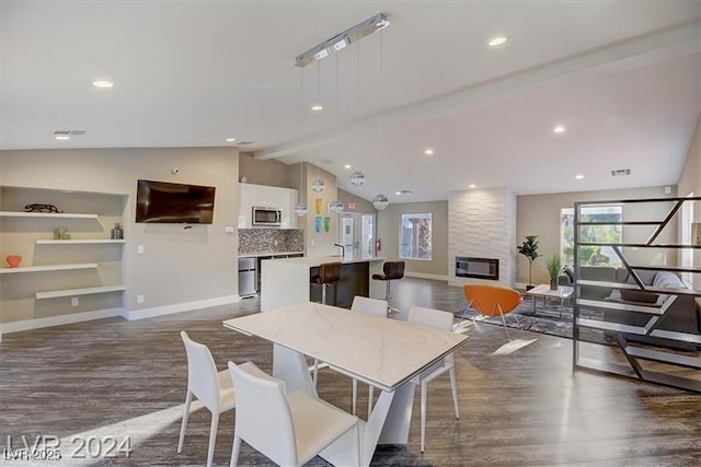 4200 S Valley View Blvd Unit 1035, Las Vegas, NV 89103 - dining room featuring dark wood-style flooring, a fireplace, and recessed lighting