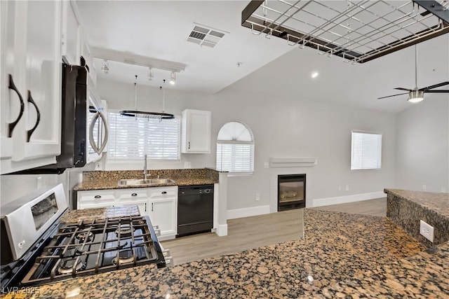 2925 Wigwam Pkwy Unit 1021, Henderson, NV 89074 - kitchen featuring dishwasher, stainless steel gas range, light wood finished floors, and white cabinets