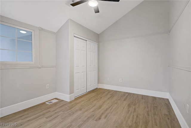 2925 Wigwam Pkwy Unit 1021, Henderson, NV 89074 - unfurnished bedroom with vaulted ceiling, wood finished floors, a closet, and ceiling fan