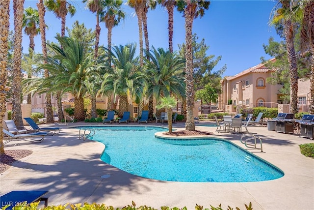 2925 Wigwam Pkwy Unit 1021, Henderson, NV 89074 - community pool with a patio and a grill