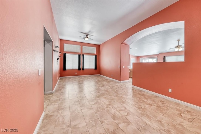 3604 Cantura Crest Ct, North Las Vegas, NV 89031 - empty room with ceiling fan and arched walkways