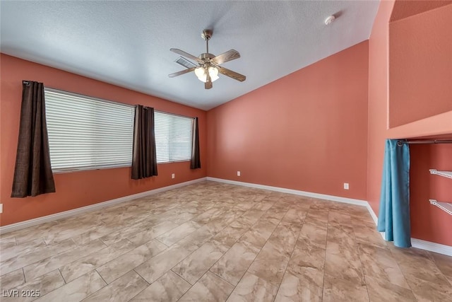 3604 Cantura Crest Ct, North Las Vegas, NV 89031 - spare room with lofted ceiling, a ceiling fan, light marble finish flooring, a smoke detector, and a textured ceiling