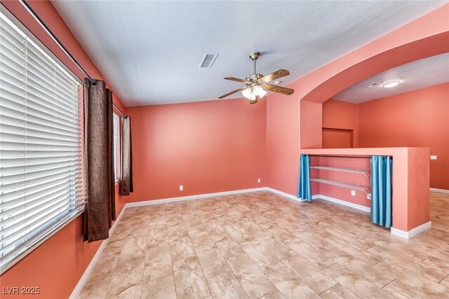 3604 Cantura Crest Ct, North Las Vegas, NV 89031 - unfurnished living room featuring ceiling fan and arched walkways