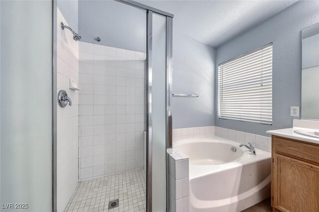 3604 Cantura Crest Ct, North Las Vegas, NV 89031 - full bath with vanity, a stall shower, and a garden tub