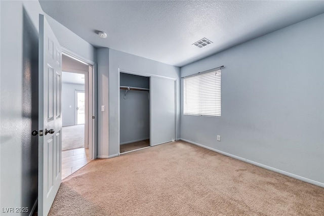 3604 Cantura Crest Ct, North Las Vegas, NV 89031 - unfurnished bedroom featuring carpet, a closet, and a textured ceiling