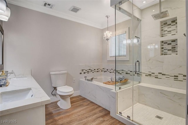 925 Alan Shepard St, Las Vegas, NV 89145 - bathroom featuring a garden tub, a marble finish shower, wood finished floors, a chandelier, and double vanity