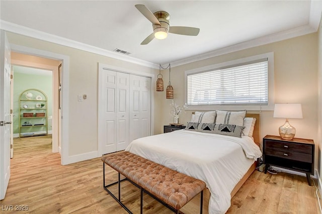 925 Alan Shepard St, Las Vegas, NV 89145 - bedroom with crown molding, light wood-type flooring, a closet, and a ceiling fan