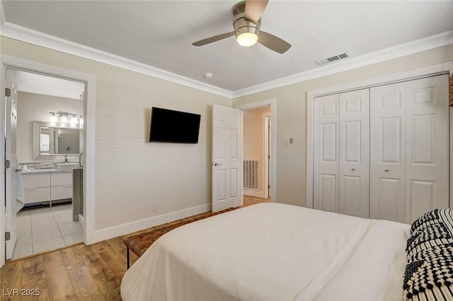 925 Alan Shepard St, Las Vegas, NV 89145 - bedroom with crown molding, a closet, light wood-type flooring, a ceiling fan, and ensuite bathroom