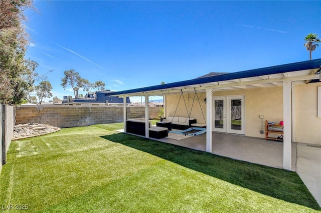 925 Alan Shepard St, Las Vegas, NV 89145 - view of yard featuring french doors, outdoor lounge area, and a patio area