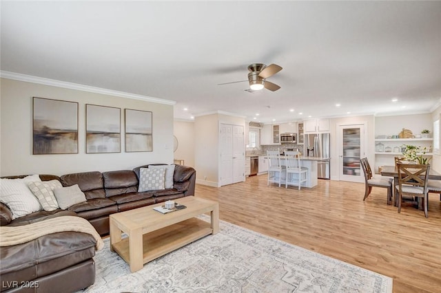 925 Alan Shepard St, Las Vegas, NV 89145 - living room featuring recessed lighting, a ceiling fan, light wood-type flooring, and crown molding