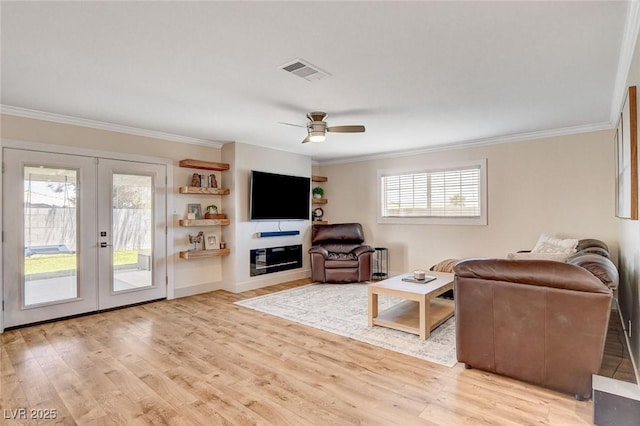 925 Alan Shepard St, Las Vegas, NV 89145 - living room with crown molding, light wood-style floors, a ceiling fan, french doors, and radiator heating unit