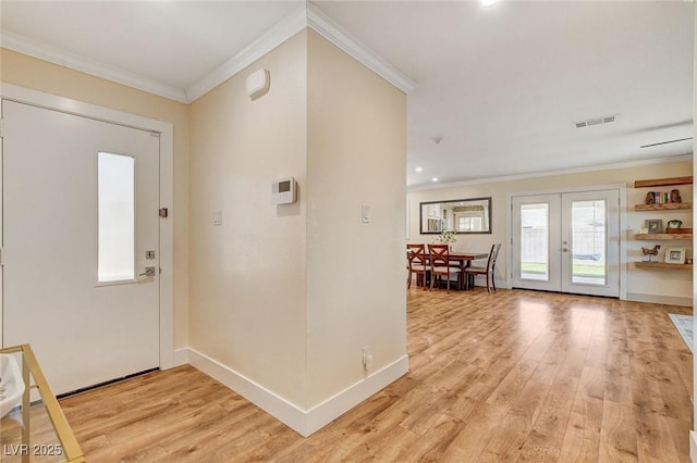 925 Alan Shepard St, Las Vegas, NV 89145 - entrance foyer featuring ornamental molding, french doors, light wood-style floors, and recessed lighting