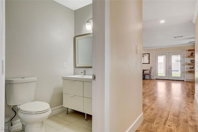 925 Alan Shepard St, Las Vegas, NV 89145 - bathroom with vanity, french doors, crown molding, and wood finished floors