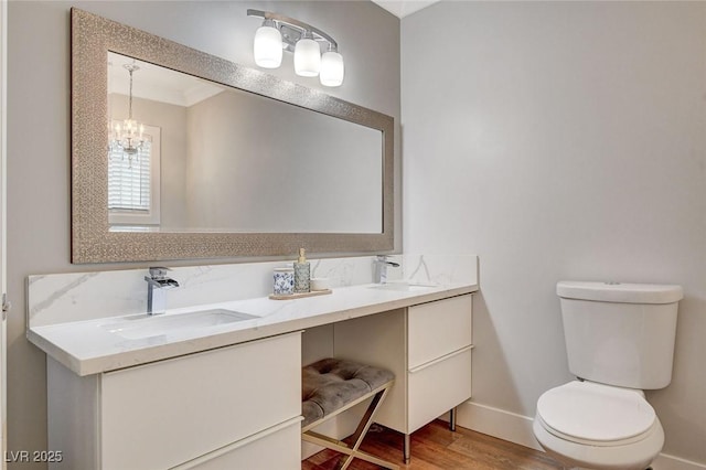 925 Alan Shepard St, Las Vegas, NV 89145 - bathroom with double vanity, wood finished floors, and a chandelier
