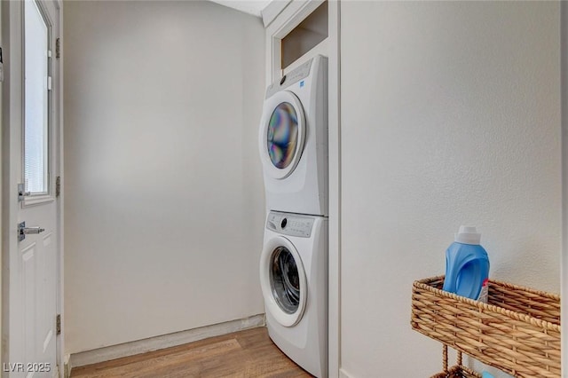 925 Alan Shepard St, Las Vegas, NV 89145 - laundry room with stacked washer / dryer and light wood-style flooring