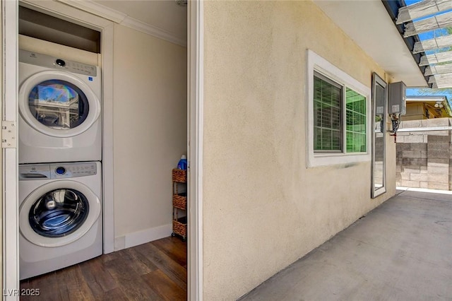 925 Alan Shepard St, Las Vegas, NV 89145 - laundry area with stacked washing machine and dryer and crown molding