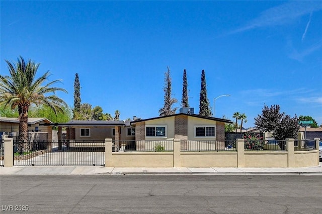 925 Alan Shepard St, Las Vegas, NV 89145 - view of front facade featuring a fenced front yard and stucco siding