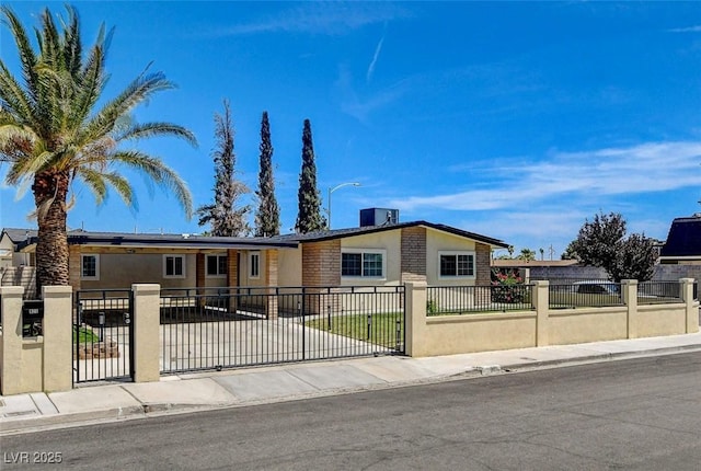 925 Alan Shepard St, Las Vegas, NV 89145 - view of front facade featuring a fenced front yard, stucco siding, and a gate