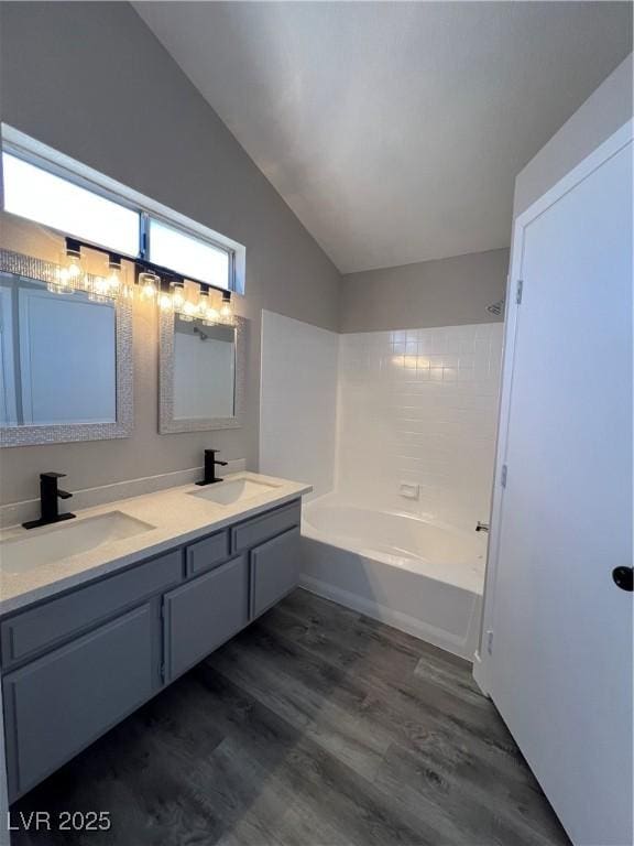 3238 Canyon Terrace Dr, Laughlin, NV 89029 - full bath featuring vaulted ceiling, double vanity, and wood finished floors