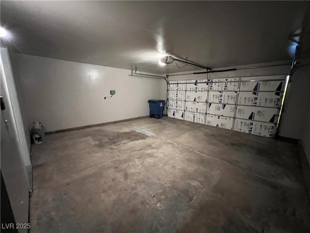 3238 Canyon Terrace Dr, Laughlin, NV 89029 - garage featuring a garage door opener and baseboards