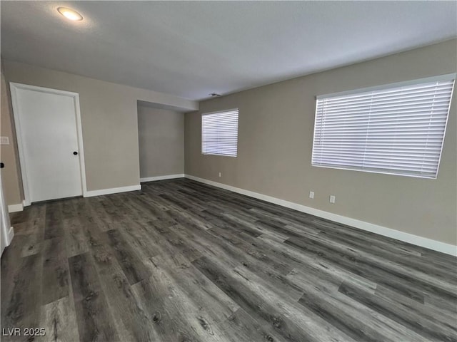 3238 Canyon Terrace Dr, Laughlin, NV 89029 - spare room featuring dark wood-style floors and baseboards