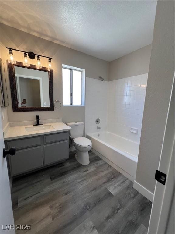 3238 Canyon Terrace Dr, Laughlin, NV 89029 - full bath featuring vanity, wood finished floors, bathing tub / shower combination, and a textured ceiling