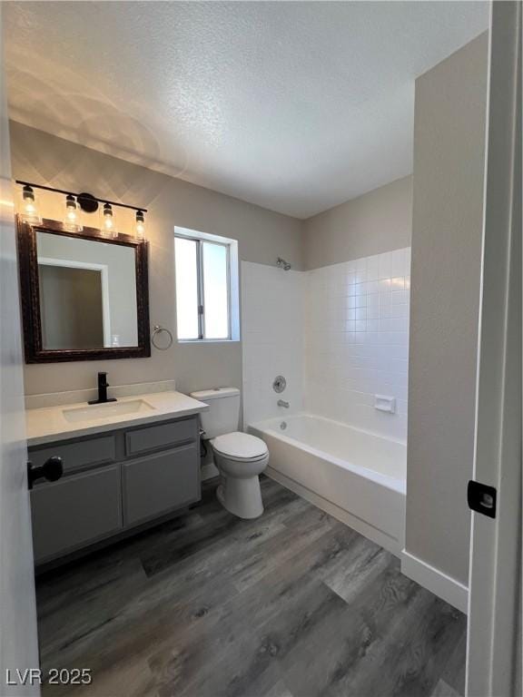 3238 Canyon Terrace Dr, Laughlin, NV 89029 - full bath featuring vanity, wood finished floors, shower / bath combination, and a textured ceiling