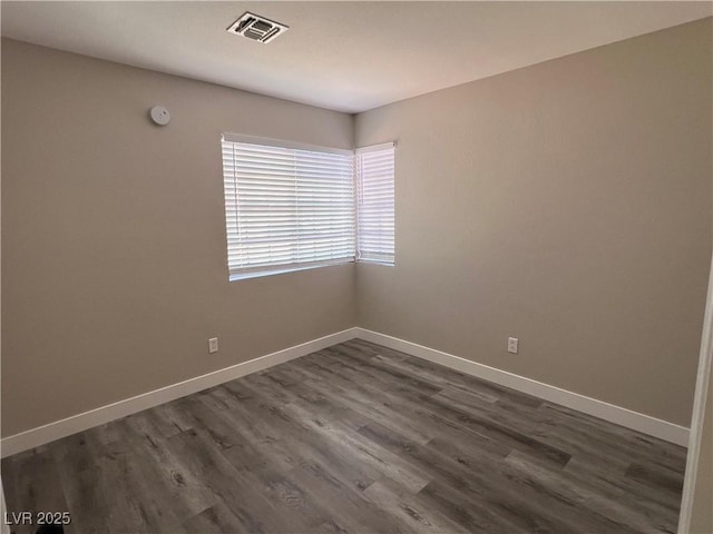 3238 Canyon Terrace Dr, Laughlin, NV 89029 - empty room with dark wood-style flooring and a smoke detector