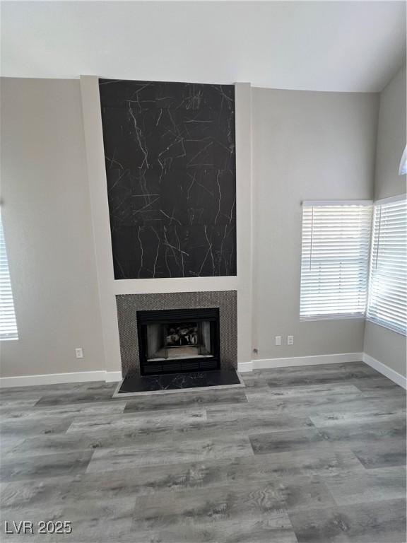 3238 Canyon Terrace Dr, Laughlin, NV 89029 - unfurnished living room with wood finished floors and a high end fireplace