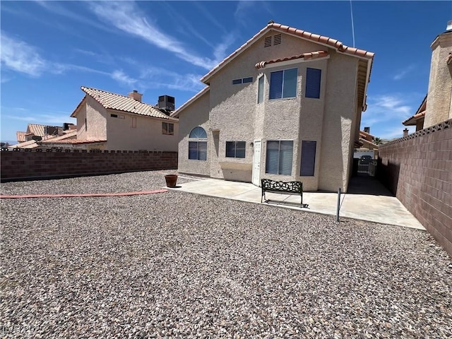 3238 Canyon Terrace Dr, Laughlin, NV 89029 - back of house featuring stucco siding, a fenced backyard, and a patio area