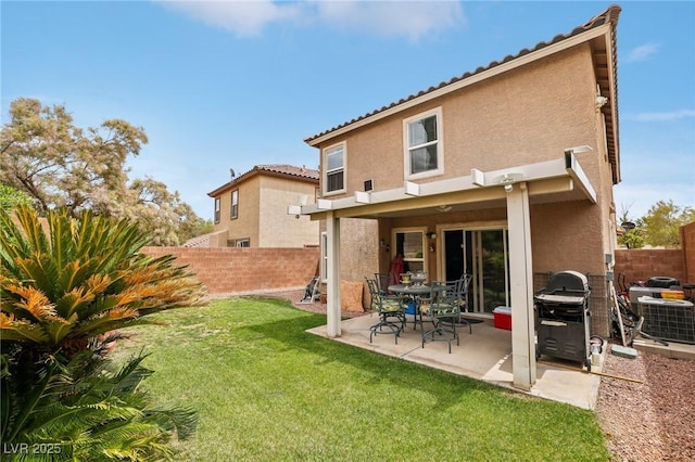 11620 Longhirst Hall Ln, Las Vegas, NV 89138 - rear view of house featuring stucco siding, a fenced backyard, a patio, and a tile roof
