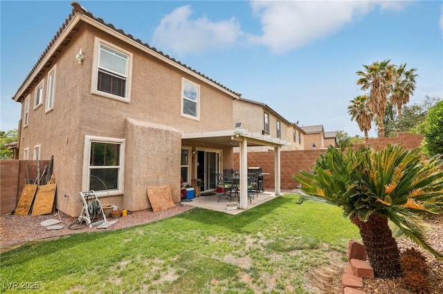 11620 Longhirst Hall Ln, Las Vegas, NV 89138 - rear view of property featuring stucco siding, a fenced backyard, and a patio