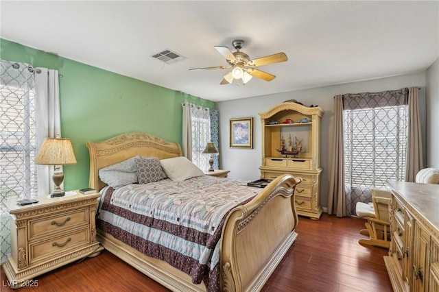 11620 Longhirst Hall Ln, Las Vegas, NV 89138 - bedroom featuring multiple windows, dark wood finished floors, and a ceiling fan