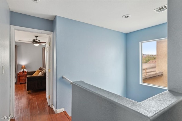 11620 Longhirst Hall Ln, Las Vegas, NV 89138 - hall with an upstairs landing and wood finished floors